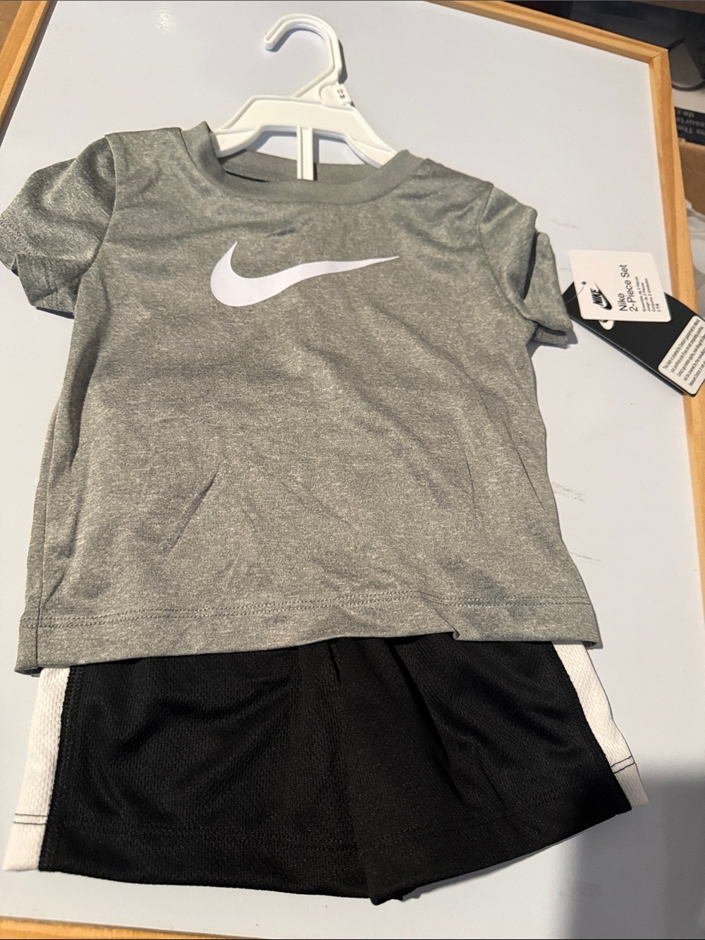 Nike Grey Tee with White Swoosh and Black Shorts